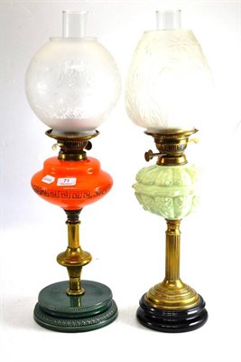 Lot 71 - Two brass and coloured glass oil lamps