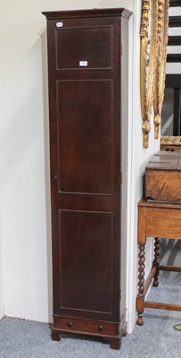 Lot 1162 - A George III Cuban mahogany narrow cupboard,...