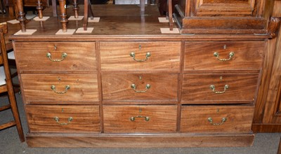 Lot 1283 - A George III mahogany wide chest comprising...