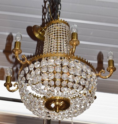 Lot 1354 - A six light chandelier with lustre drop bag,...