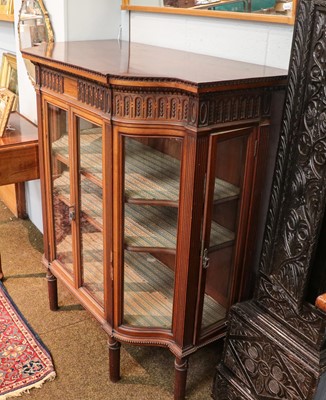 Lot 1344 - An Edwardian walnut serpentine display cabinet,...