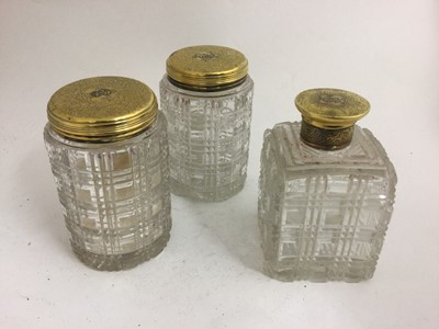 Lot 2103 - A Set of Three Victorian Silver-Gilt Mounted Cut-Glass Dressing-Table Jars