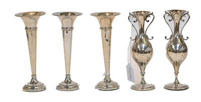 Lot 201 - A group of five silver vases, three trumpet...