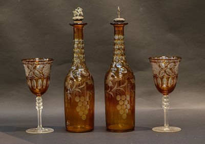 Lot 67 - A pair of cut amber tinted carafes and two...