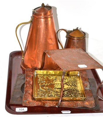 Lot 104 - Two copper Benson water jugs, Keswick brass tray, Perry & Sons tray and a bottle stand, copper...