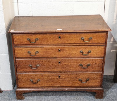 Lot 1207 - A George III oak four height chest of drawers,...