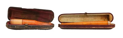 Lot 347 - An amber cigar holder with a 9 carat gold...