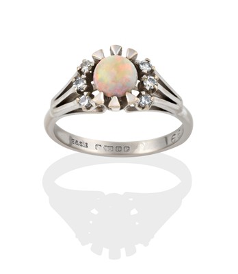 Lot 2270 - An 18 Carat White Gold Opal and Diamond Cluster Ring
