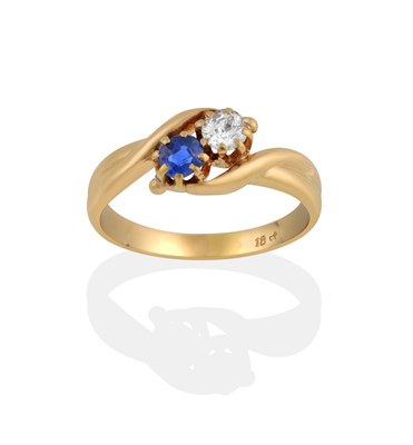 Lot 2313 - A Sapphire and Diamond Twist Ring