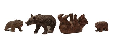 Lot 93 - Four Black Forest small carved bears, early...