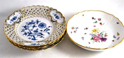 Lot 117 - Three Meissen blue and gilt decorated cabinet plates and a Meissen floral decorated bowl with...