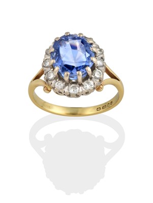 Lot 2300 - An 18 Carat Gold Sapphire and Diamond Cluster Ring