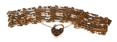 Lot 40 - A gate link bracelet with a 9 carat gold...