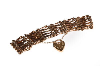 Lot 57 - A 9 carat gold gate link bracelet with a...