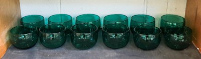 Lot 235 - A set of twelve green glass finger bowls
