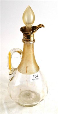 Lot 134 - Claret jug with silver collar