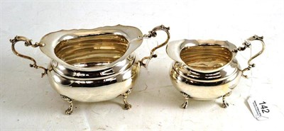 Lot 142 - A silver milk jug and sugar bowl, by H.W, Sheffield 1933