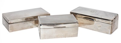 Lot 413 - Three silver cigarette boxes, each oblong and...
