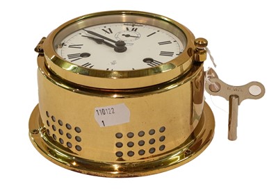 Lot 335 - A modern brass ship's clock, retailed by Wempe,...