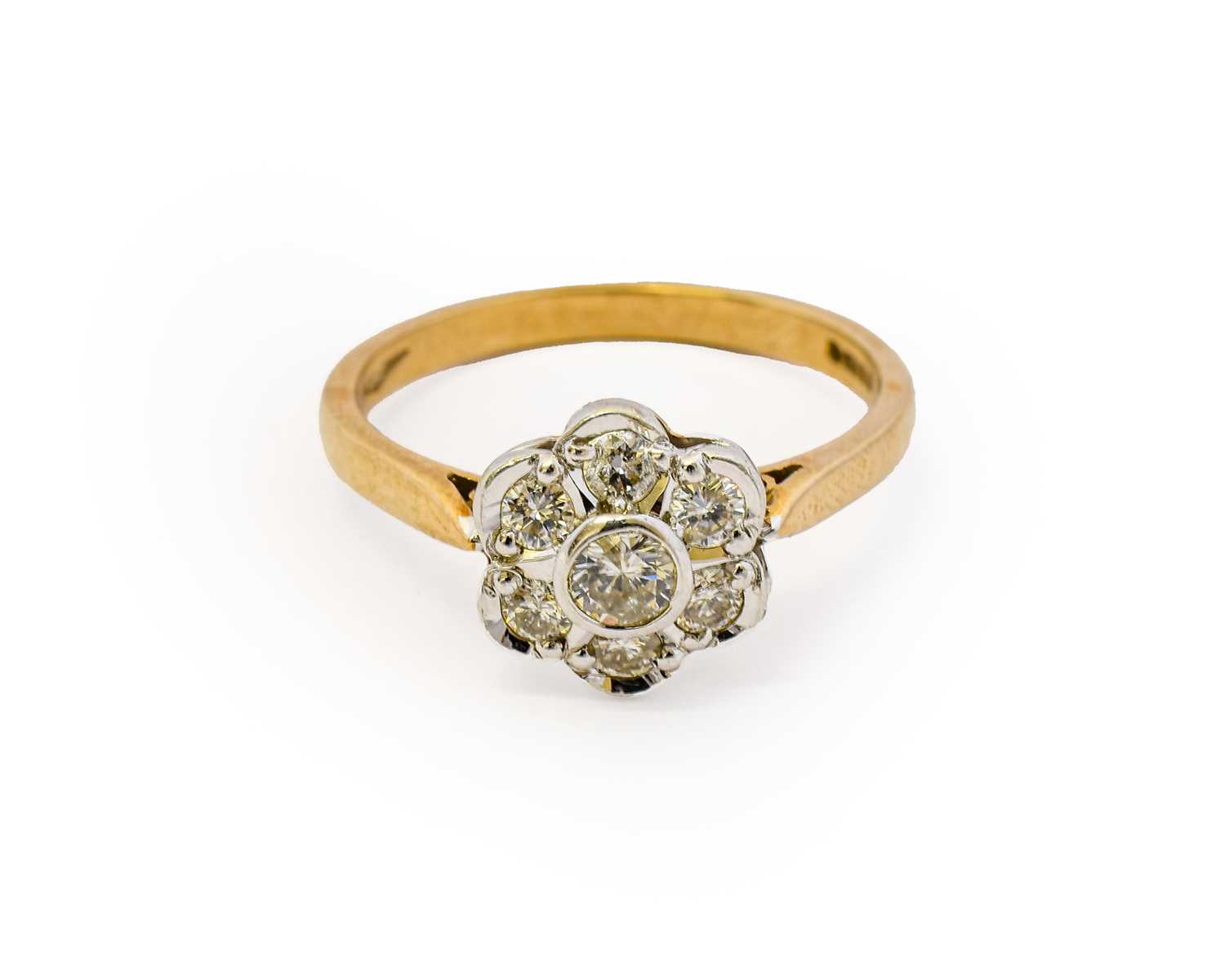 Lot 1122 - A 9 carat gold diamond cluster ring, the round...