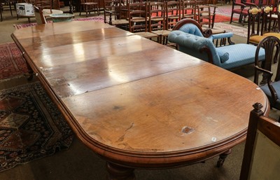 Lot 1341 - A Victorian pollard oak wind out dining table,...