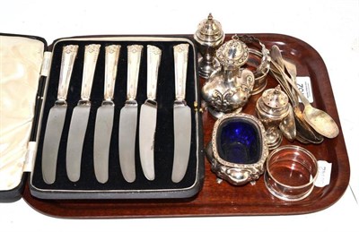 Lot 152 - Tray including three silver napkin rings, Scottish silver teaspoons, pepperettes and two cases...