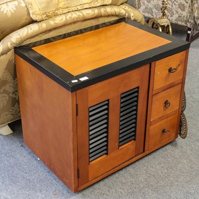 Lot 1143 - A contempory pine and part ebonised sideboard...