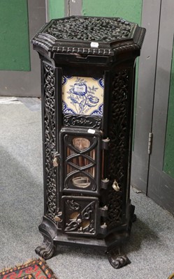 Lot 1140 - A French enamelled cast iron stove of canted...