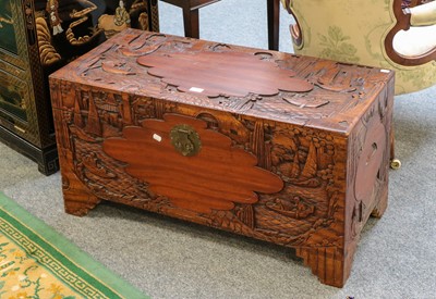 Lot 1181 - A carved camphor wood chest decorated with...