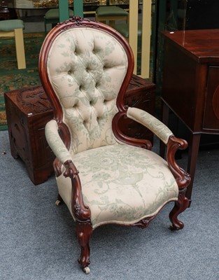 Lot 1186 - A Victorian carved walnut armchair with button...