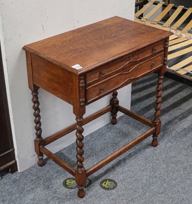 Lot 1164 - An early 20th century oak two drawer side...