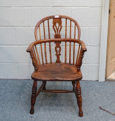Lot 1175 - A 19th century ash & elm Windsor armchair with...