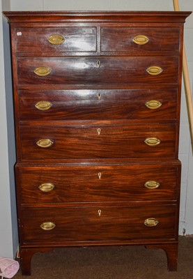 Lot 1259 - A George III mahogany chest on chest with oval...