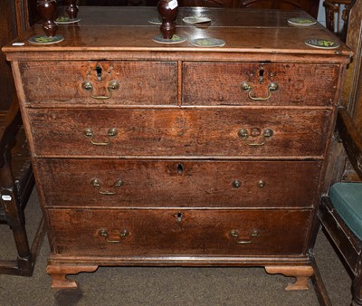 Lot 1293 - A George III oak four height chest of drawers...