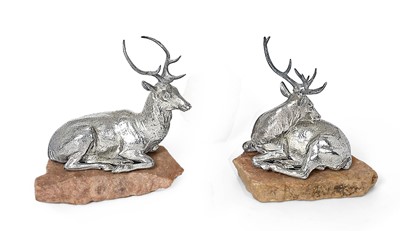 Lot 2088 - A Pair of Victorian Silver-Gilt Models of Recumbent Stags