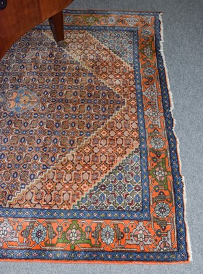 Lot 1230 - North West Persian carpet, the pale terracota...