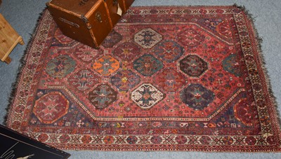 Lot 1233 - Kashgai carpet, the faded raspberry field with...