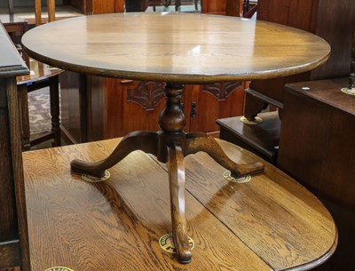 Lot 1324 - A 1920s oak barley twist drop leaf dining...