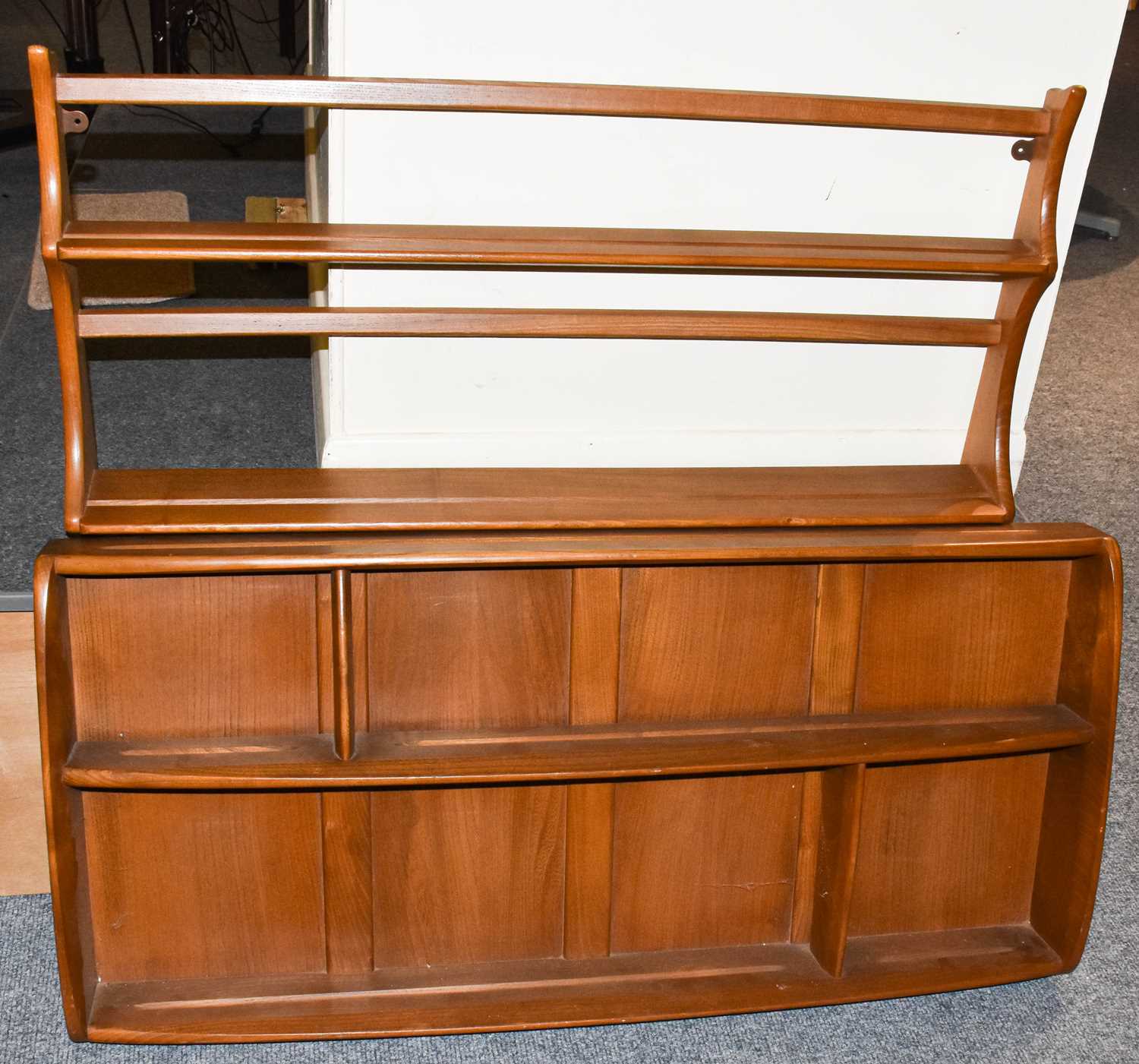 Lot 1235 - An Ercol elm two-tier open plate rack and an...