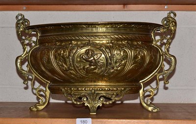 Lot 180 - An embossed brass oval jardiniere