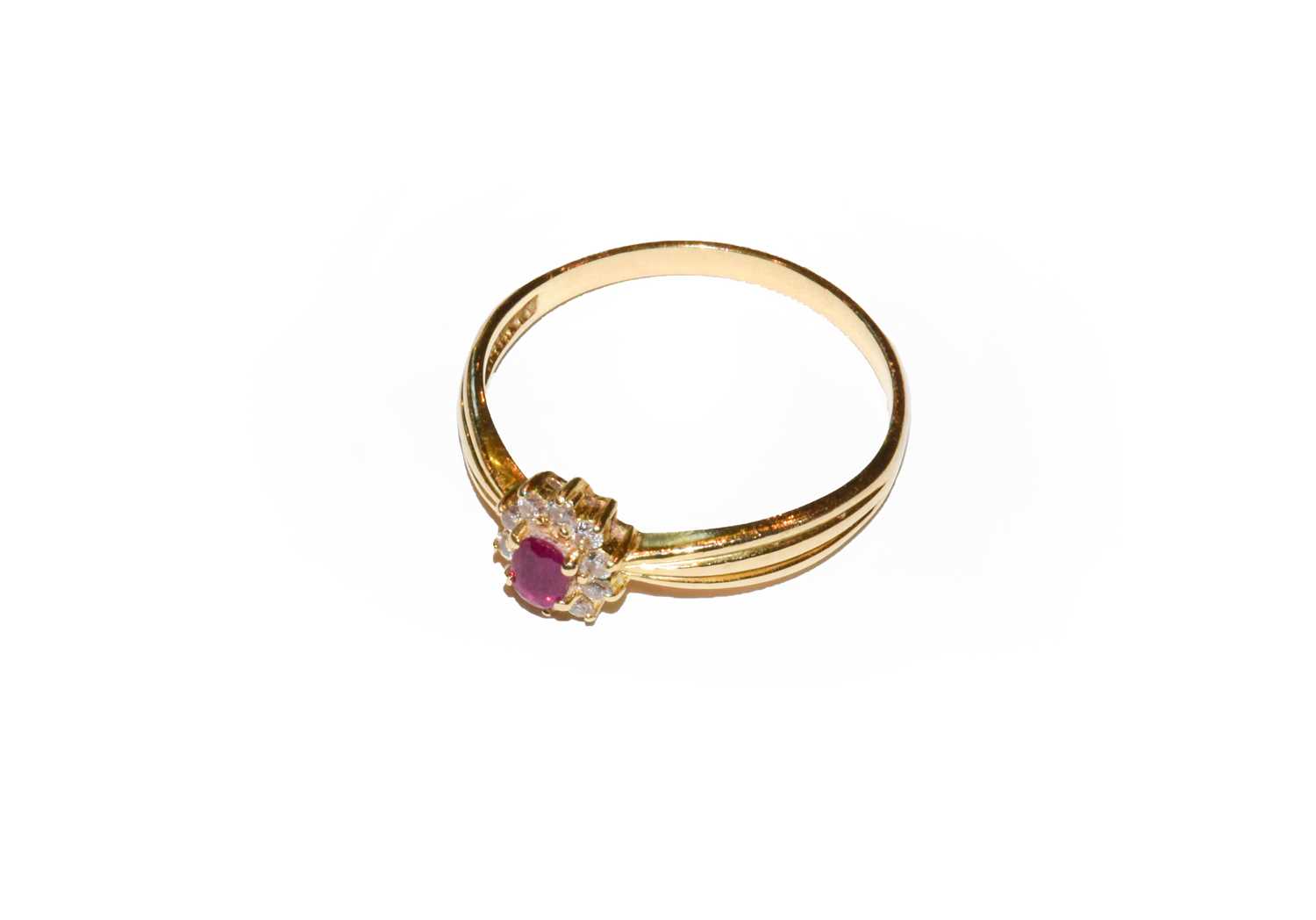 Lot 65 - A ruby and diamond cluster ring, unmarked,...