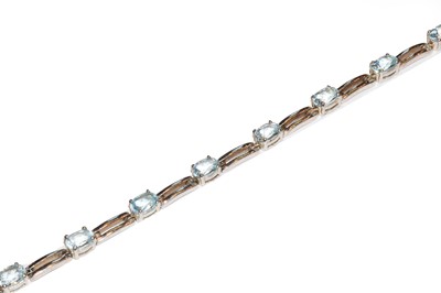 Lot 92 - A silver blue topaz bracelet, length 18.5cm;...