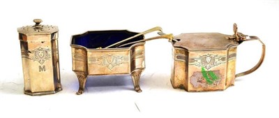 Lot 198 - Silver three piece condiment set engraved with a family crest and the initial 'M'