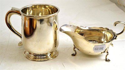 Lot 203 - Silver mug and a silver sauce boat