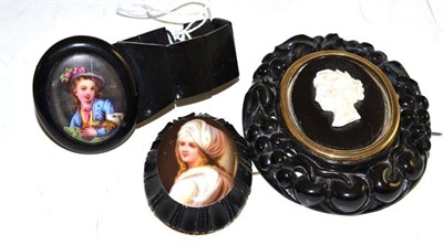 Lot 209 - A jet bracelet with painted panel, a jet brooch with painted panel and a jet cameo brooch