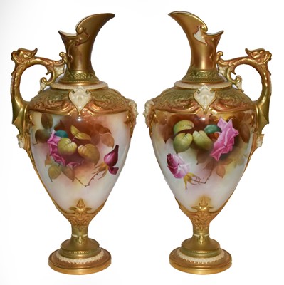 Lot 403 - A pair of Royal Worcester pedestal ewers...