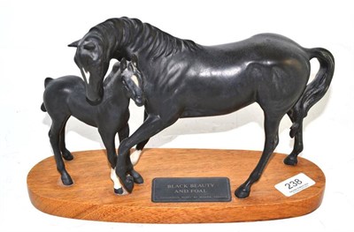 Lot 238 - Beswick figure Black Beauty and foal on wooden base