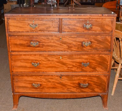 Lot 1324 - A George III mahogany chest of two short and...