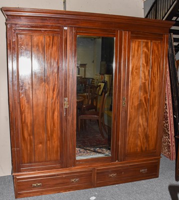 Lot 1387 - An early 20th century wardrobe with central...