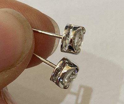 Lot 2271 - A Pair of 18 Carat White Gold Diamond Solitaire Earrings